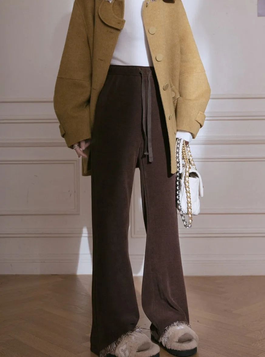 Cut-out raw knitted flared trousers